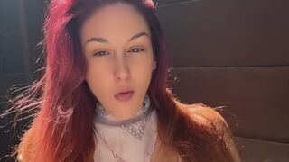 Artemisia Love blowing bubbles and smoking outdoor
