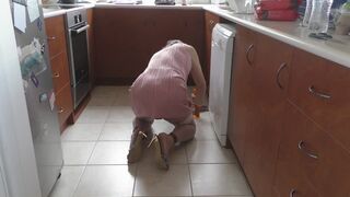Sissy in Ankle Cuffs and Stiletto Mules cleaning kitchen floor