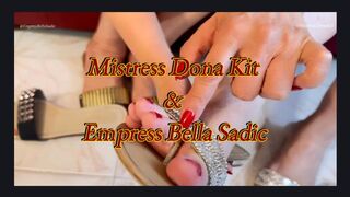 Empress Bella Sadic shows her new slippers to Mistress Dona Kit