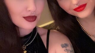 Lesbians pop balloons in a grungy basement