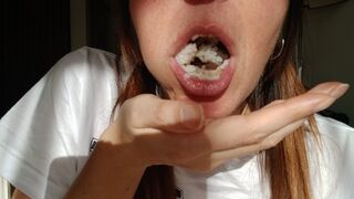Lania eating salmon onigiri