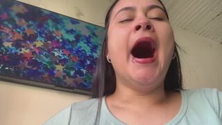Yawns of a cute girl