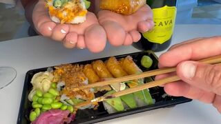 Beautiful small cute soft bare feet enjoying sushi all over the soles