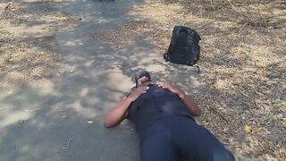 woman sitting on the security guard's face