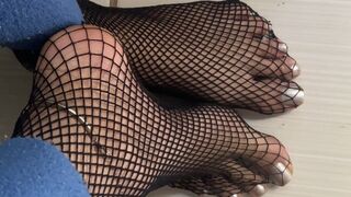 sensualizing in fishnet stockings