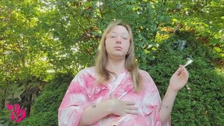 Smoking Slims in the Garden in Pink Bathrobe and coughing