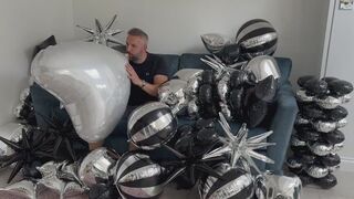 JL blows up a huge heart Mylar balloon