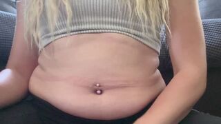 Watch my belly grow while I engorge myself with a massive burger, fries, and onion rings! I squish and squeeze and jiggle my belly between every bite.