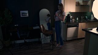 Bratty model unwraps and sucks on a big, round lollipop between shoots wearing tight jeans, heels and a tiara.