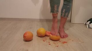 Stella crushing grapefruits barefoot