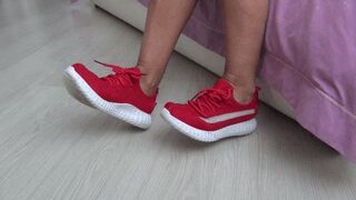 Wiggling my toes in my soft red sneakers d