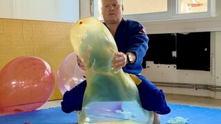 Karate Guy Sitpops 14 Giant Balloons in a Dojo