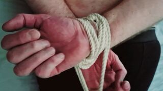 Slow motion handjob on a hogtied helpless man