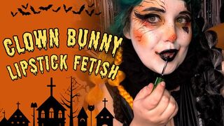 Clown Bunny reapplying her lipstick