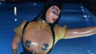 Rubbermissy Swimming in total latex enclosure in transparent rubber and latex mask