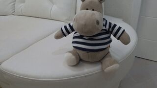 A plush toy on my crossed legs c