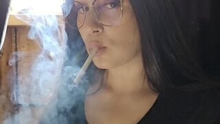 Pretty girl smoking for you in glasses in GORGEOUS sunlight