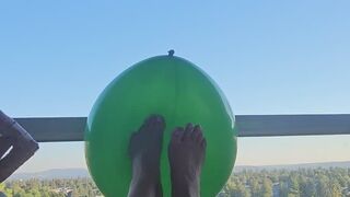 Playing footsies with a green balloon????