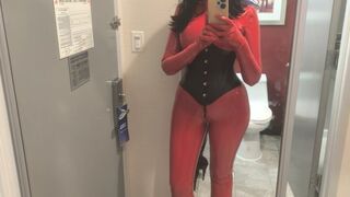 Rubberdoll Sura walking through the hotel corridors