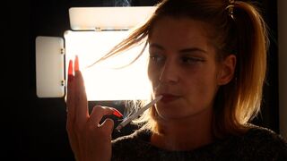 Eve’s elegant long-cigarette smoking tease and striking red nails