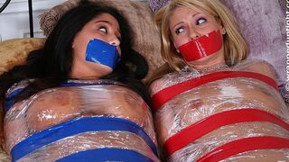 Two Bed Bound Babes Samantha Ryan And Jenaveve Jolie Wiggle Side By Side In Matching Plastic And Tape Wrappings!