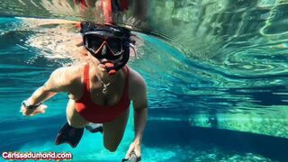 Carissa in the spring wearing a red one-piece vintage bathing suit