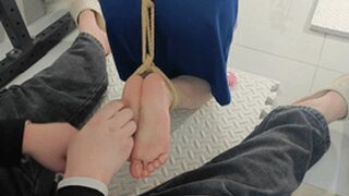 xy350 - Barefoot girl with her neck and hands bound by metal, her feet suspended and tickled.