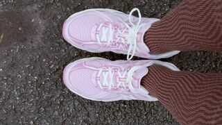 Showing New Balance and Converse Shoes on a Parking Lot