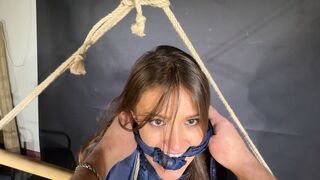 Marie bound, gagged and spanked in shiny nylon Shorts and a Windbreaker