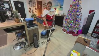 MRS CLAUS VACUUMING DOWNSTAIRS