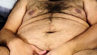 Masked bear jerking off in bed