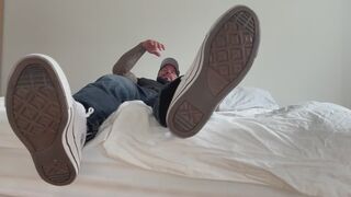 you sit at the edge of my bed worshipping my sneakers socks and barefeet
