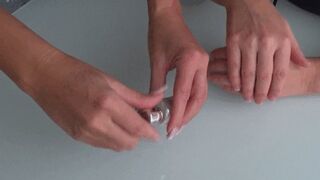 videos of women rubbing lotion on their hands c