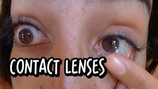 Close-up of contact lens insertion