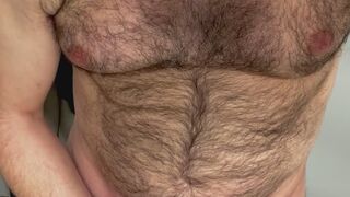 Thick, hairy man with a big, uncut cock blows a massive load.