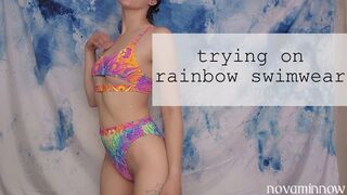 trying on rainbow swimwear