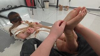 xy353 - A cute barefoot girl is bound by ropes and has her feet tickled.