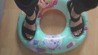 Stomping on a Swim Ring in Sandals