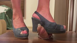Cum under Monica’s wedges inside a condom