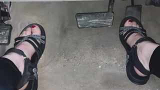 Evalynn playing with the pedals in sandals