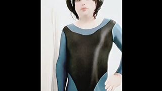 Shemale Ruby in shiny turquoise unitard and shiny black leotard