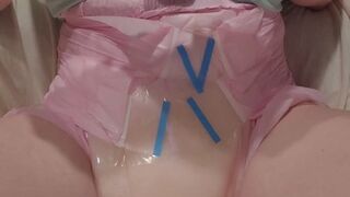 Peeing twice in an already soaked pink diaper