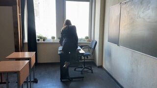 The teacher gave the test to the students and while they were doing it, the teacher was playing with her shoes