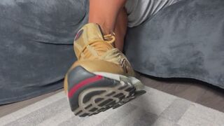 Gold Nike and toes