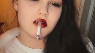 Anna smoking with red lips