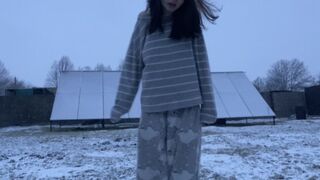 Extremely hard shivering, trembling from the cold on the snow in pajamas