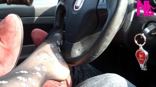 Footsie in the car in black floral pantyhose