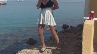 Smoking on the beach! Silver pvc skirt! And tights!