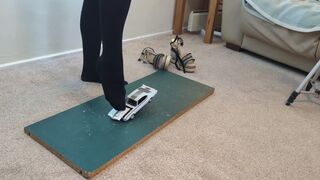 Giantess Lily Kink toy car crush of a 1969 Oldsmobile Hurst in Nylons then in big mega wedges high left view