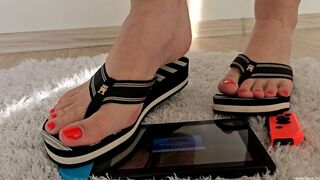 Trampling Nintendo Switch in Striped Sandals